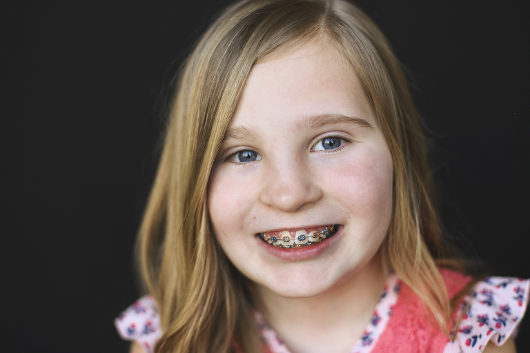 Young girl with braces looking at camera | St. Louis School Photographer