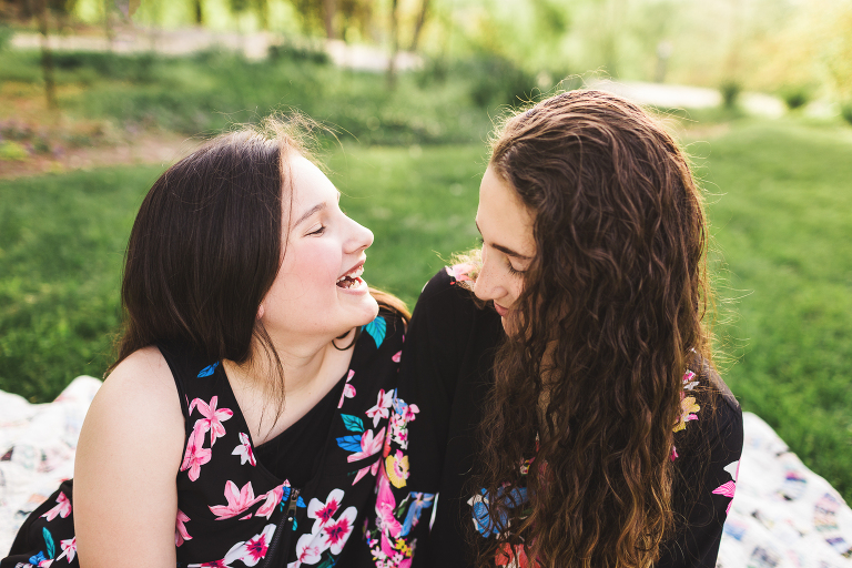 Sisters at Queeny Park making each other laugh | St. Louis Family Photographer