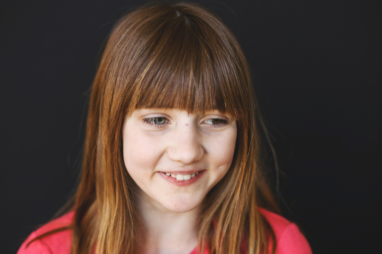 Young lady looking away from camera for school photo | St. Louis School Photographer