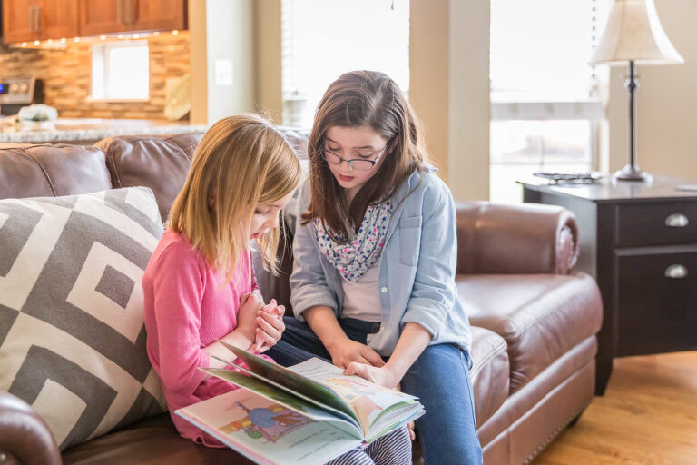Big sister reading with little sis | Kirkwood Photographer