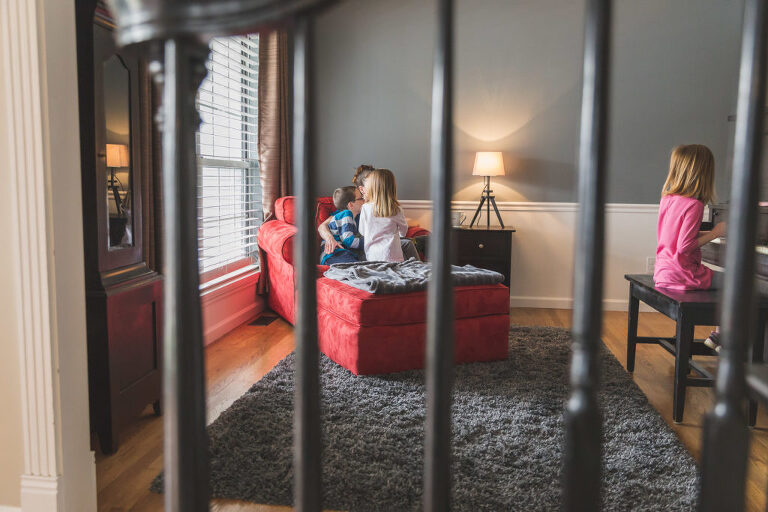 Mom and three kids sitting in den | St. Louis Family Photography