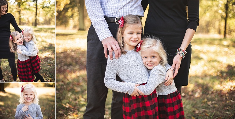 Two sisters hugging while parents look on | St. Louis Family Photography