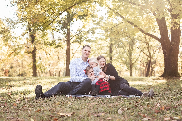 Family of Four snuggling in warm fall sunshine | St. Louis Photographer