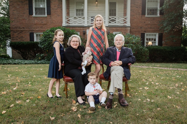 Grandparents in front of their house with four of their grandchildren | St. Louis Family Photos
