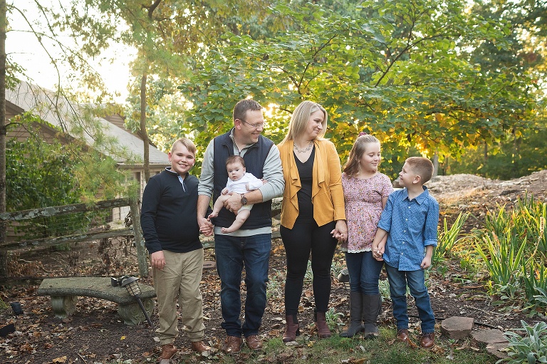Family posing for photo on sunny fall evening | KGriggs Photography