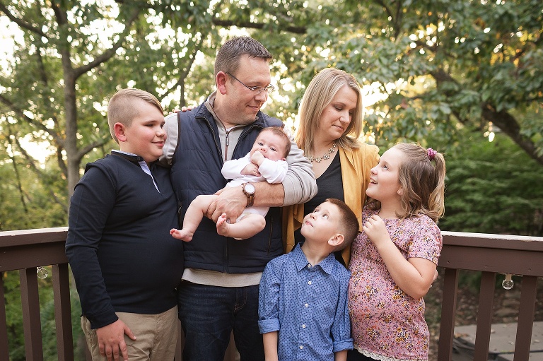 Family of six standing on their back deck during sunset | KGriggs Photography